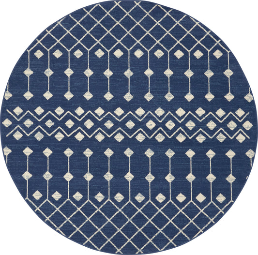 Round navy blue rug with white geometric lattice and diamond motifs in horizontal bands.