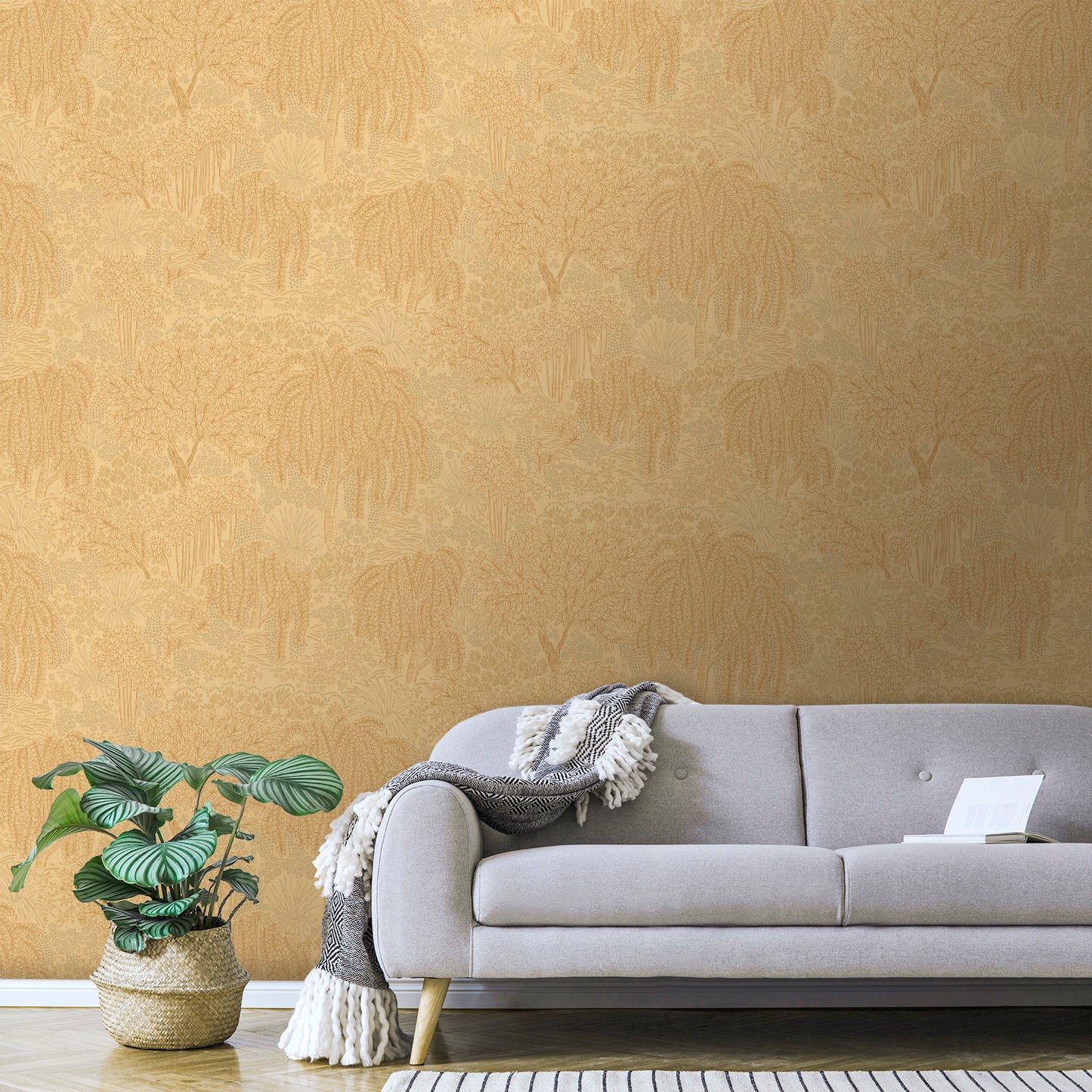 Orange palm-pattern wallpaper visible in a room with a beige mid-century sofa, grey cushions, a fringed throw, and a monstera plant in a woven basket.