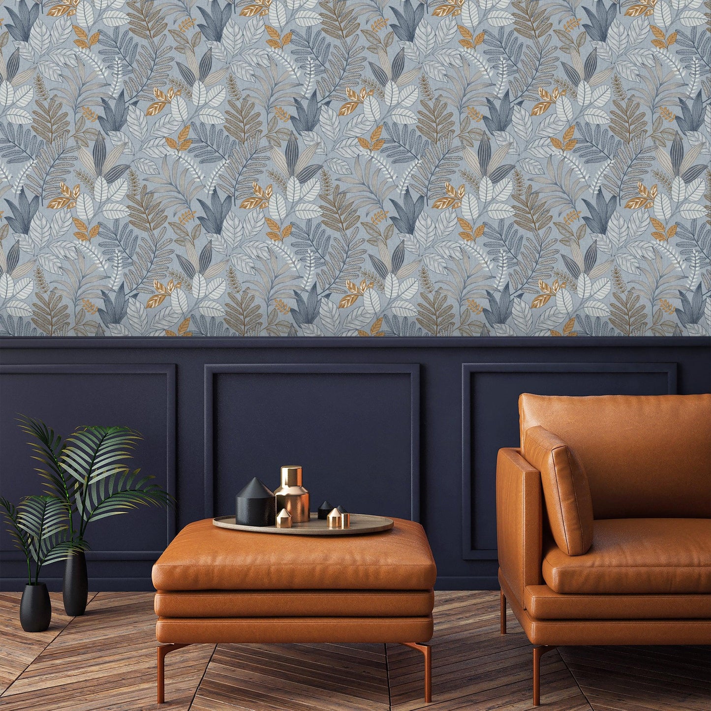 Living room with dark navy paneling, blue-gray leaf wallpaper, orange leather sofa and ottoman, round tray and plant.