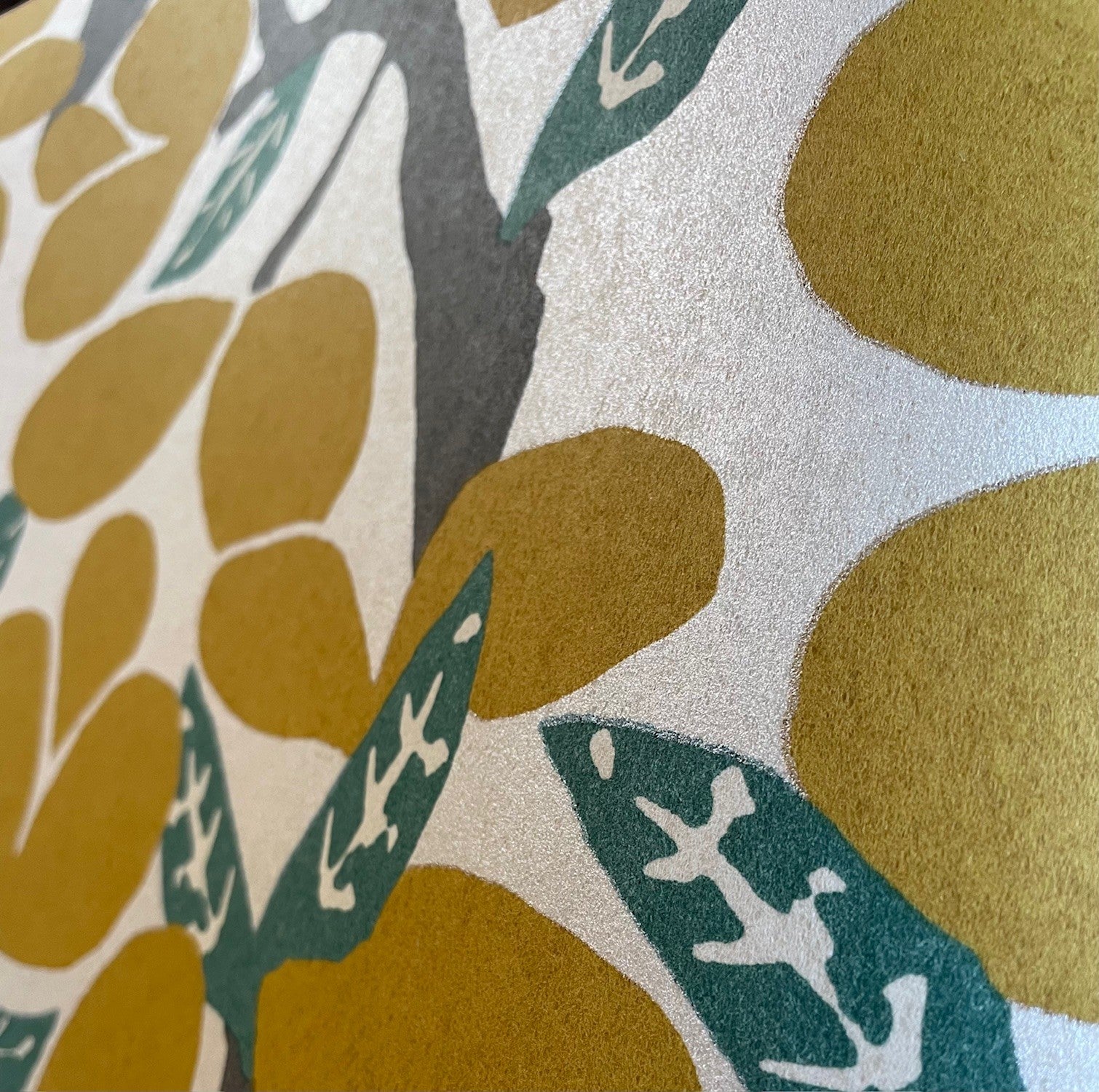 Citron wallpaper featuring layered tropical leaves in yellow and gold tones; non-woven wallcovering suitable for bright accent walls or modern interiors.