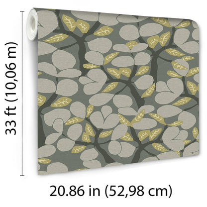 Roll of wallpaper with botanical pattern: gray rounded leaves on dark branches with yellow-gold accent leaves.