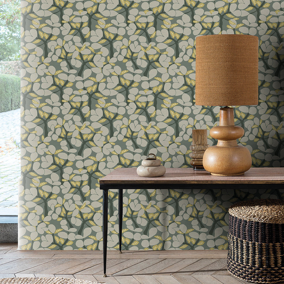 Sage green leaf-pattern wallpaper with a botanical design.