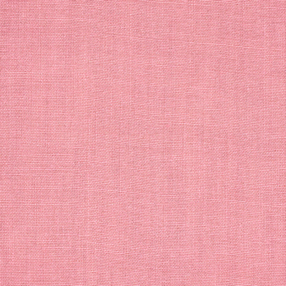 Soft pink woven fabric texture with fine interlacing; cotton-linen look, smooth drape for apparel or home textiles.