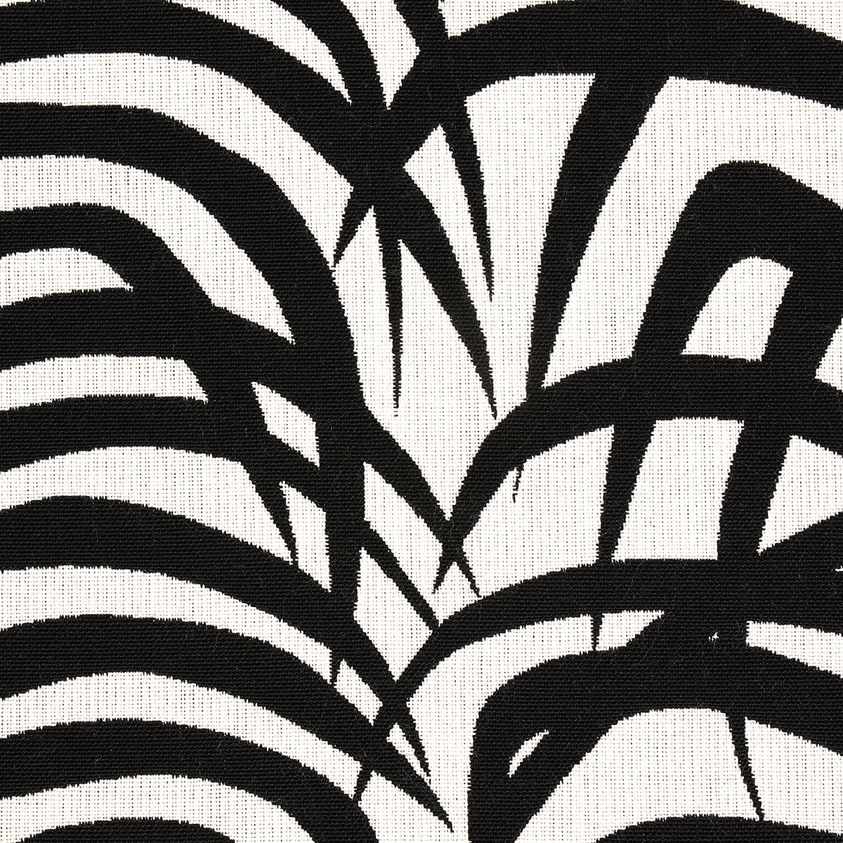 Abstract black brushstroke pattern on cream fabric; zebra-inspired geometric textile design.