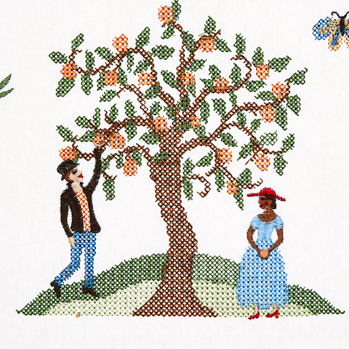 Cross-stitch illustration of a fruit-bearing tree on a hill with a man in jeans and a woman in a blue dress nearby; butterfly in corner.