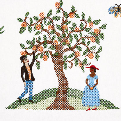 Cross-stitch illustration of a fruit-bearing tree on a hill with a man in jeans and a woman in a blue dress nearby; butterfly in corner.