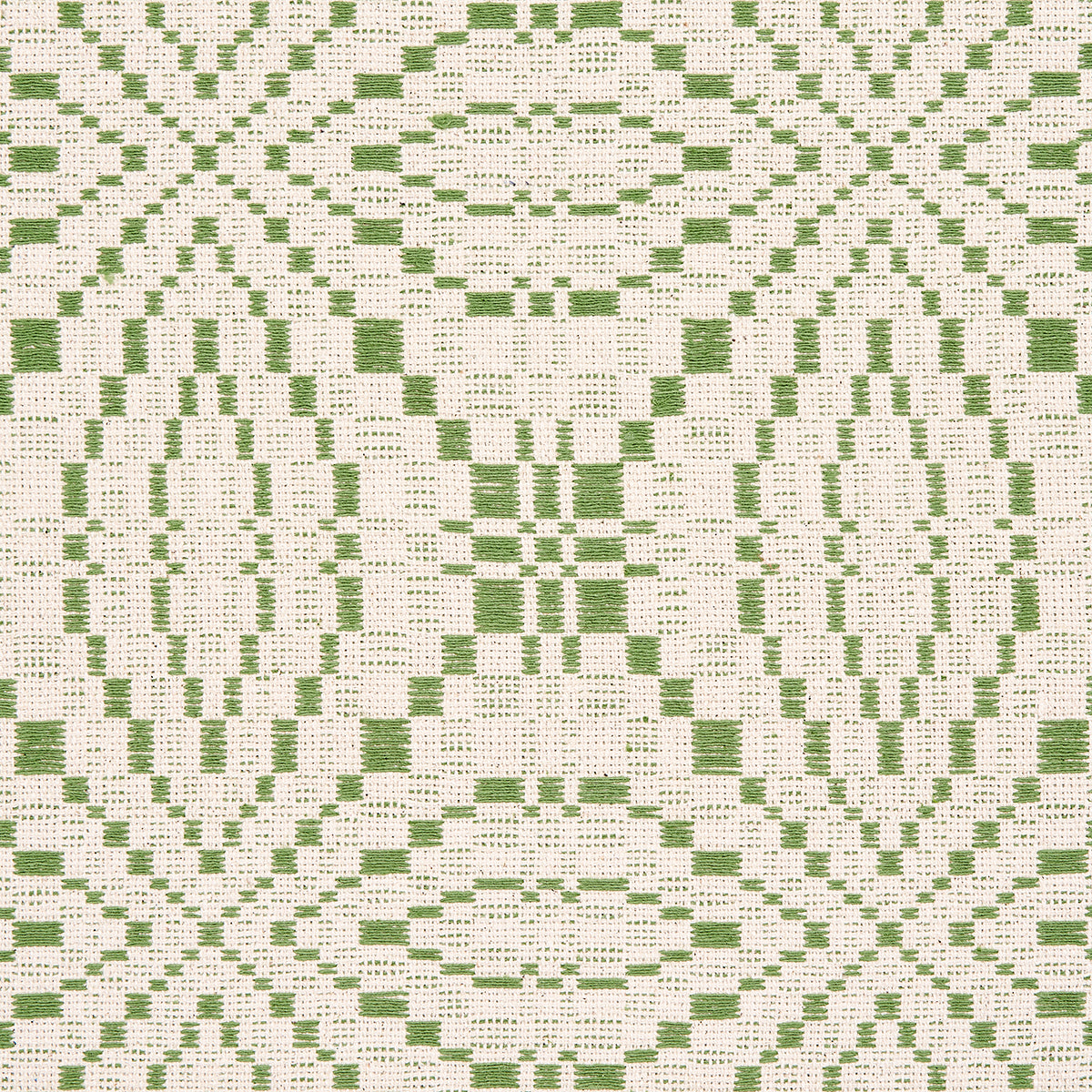 Green geometric damask-inspired woven fabric with oval/diamond lattice and a leaf motif on cream background; coverlet pattern woven fabric.