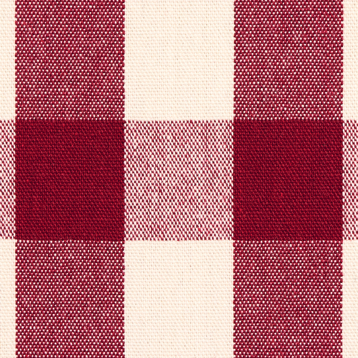 Red and cream buffalo-check plaid fabric; woven textile with large squares for shirts or blankets.