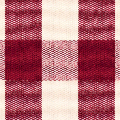 Red and cream buffalo-check plaid fabric; woven textile with large squares for shirts or blankets.
