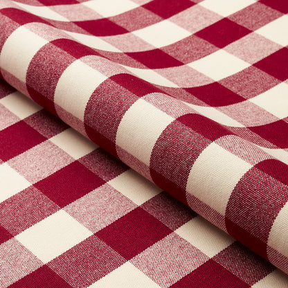 Rolled red and white gingham fabric with classic checkered pattern and soft woven texture.
