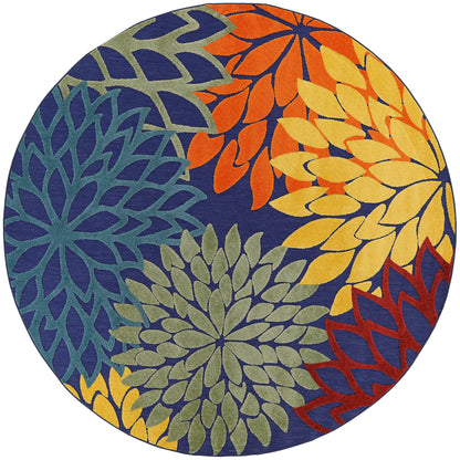 Round rug with colorful floral mandala petals in blue, teal, green, yellow, orange on navy background.