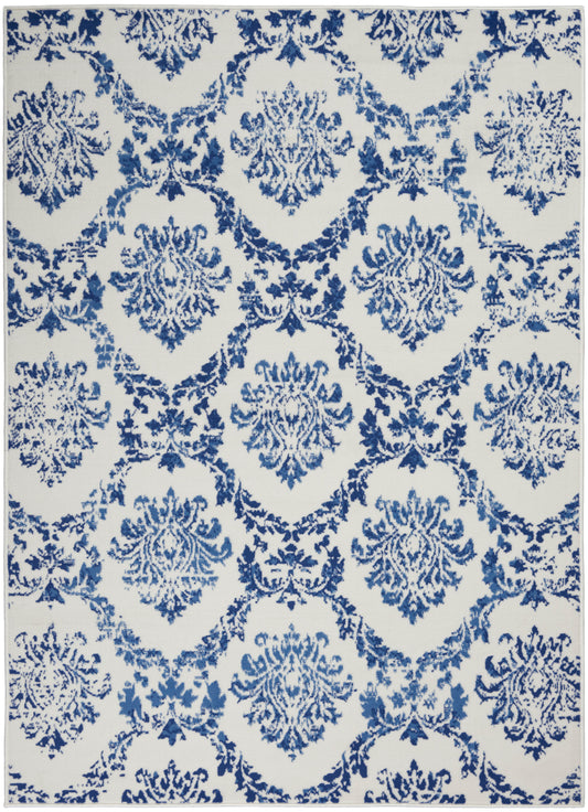 Blue damask floral pattern with repeating ornate medallions on ivory background; classic rug or textile design.
