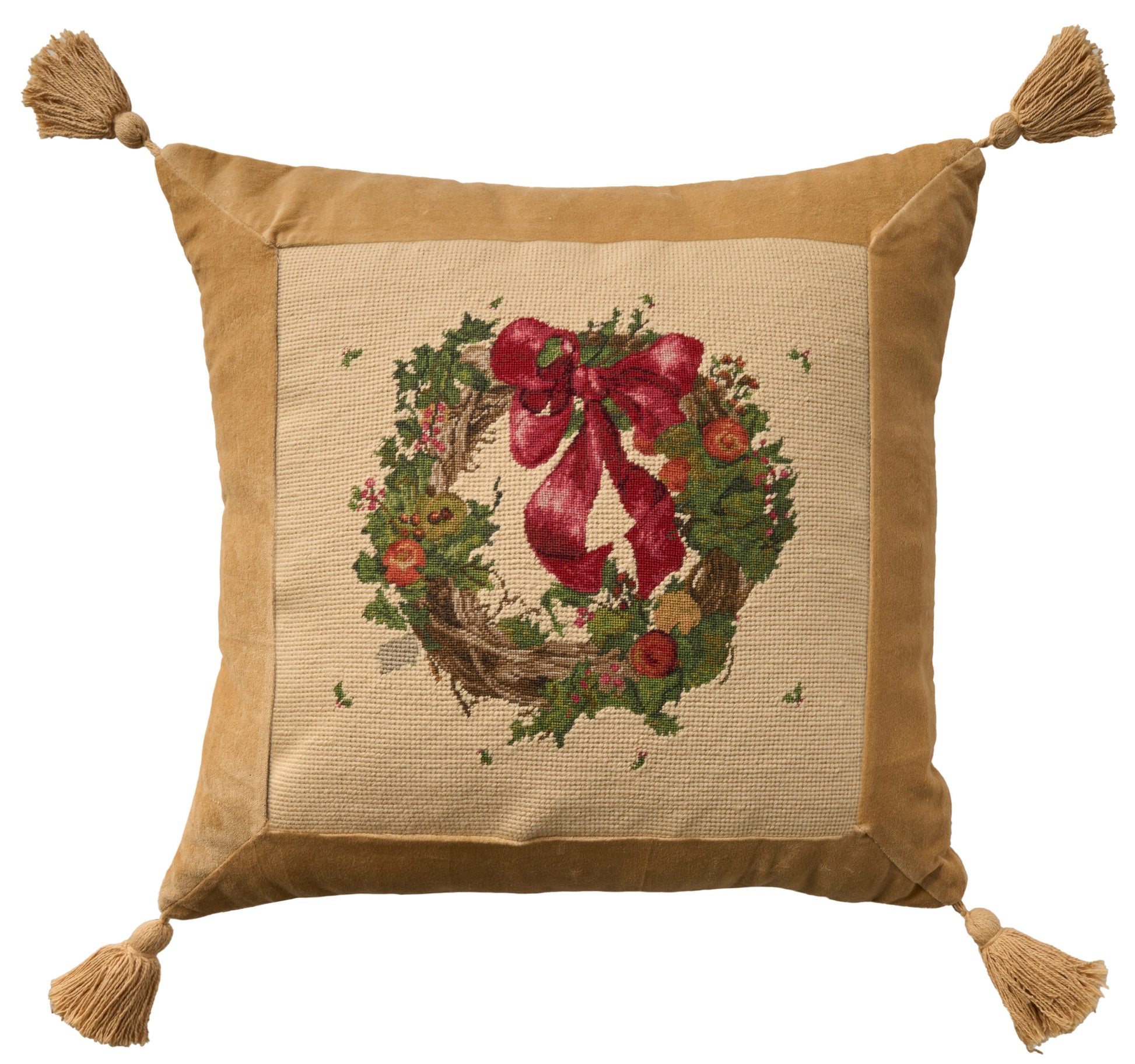 Tan velvet bordered throw pillow with a burlap center featuring a Christmas wreath and red bow; tassels on all four corners.