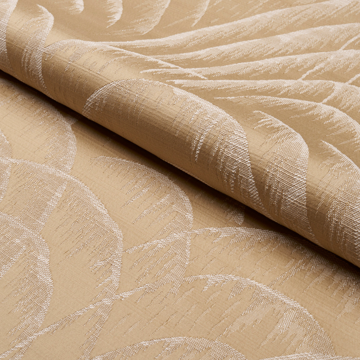 Beige jacquard fabric with a subtle leaf motif; textured weave for drapery or upholstery.