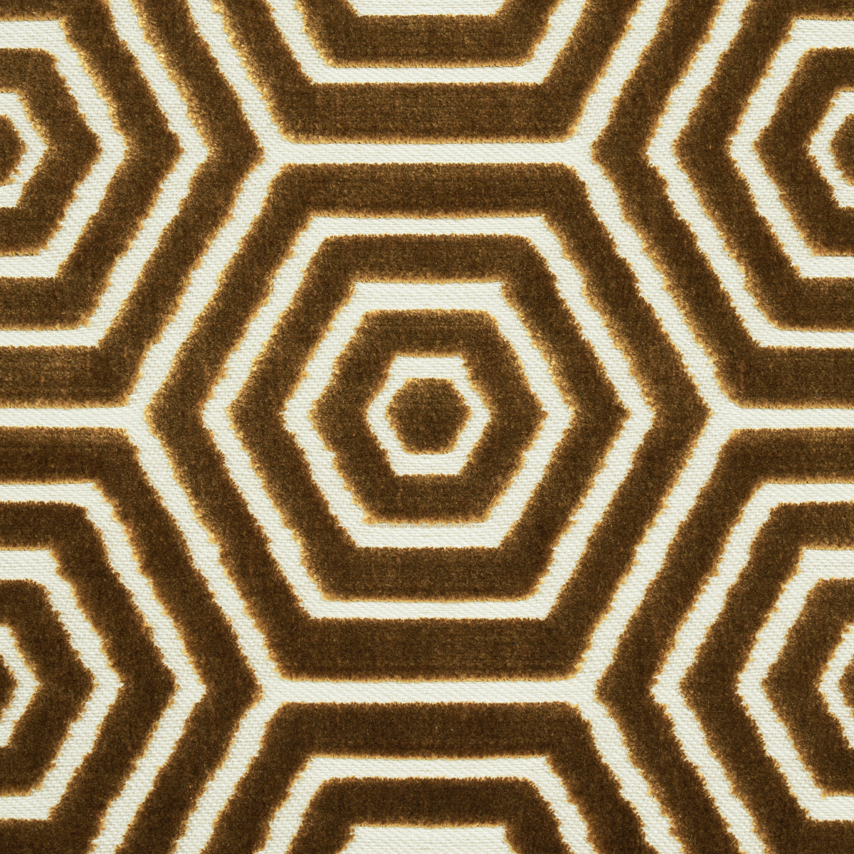 Shaggy brown and cream rug with concentric hexagon geometric pattern; cozy modern living room decor.