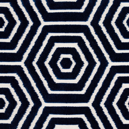 Navy blue and white geometric hex pattern textile with concentric hex rings, rug or throw fabric.