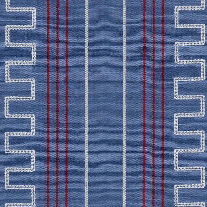 Blue woven fabric with white zigzag borders along edges and central vertical white and red stripes.