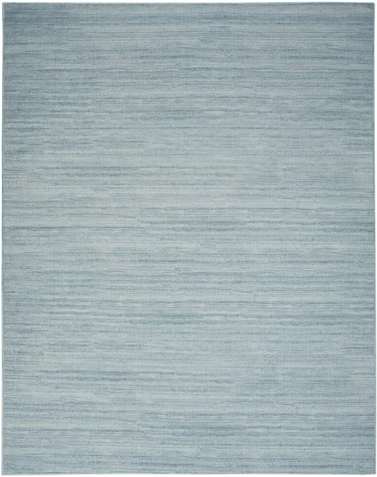 Light blue-gray rug with subtle horizontal striations and a soft, casual texture.