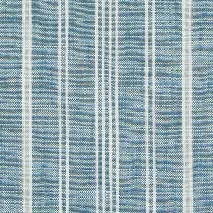 Blue woven fabric with vertical white stripes in varying widths, textile texture.