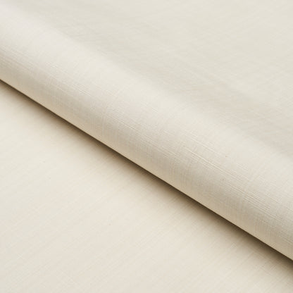 Cream linen fabric rolled up, subtle textured weave and soft drape in a neutral beige.