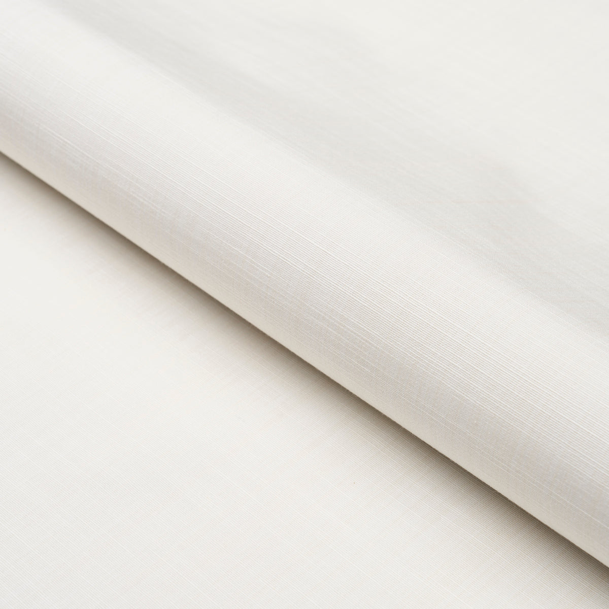 Cream-white linen-like fabric roll with subtle weave and soft drape.
