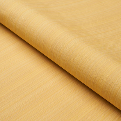Golden beige fabric roll with subtle crosshatch texture, curved edge, linen-like material.
