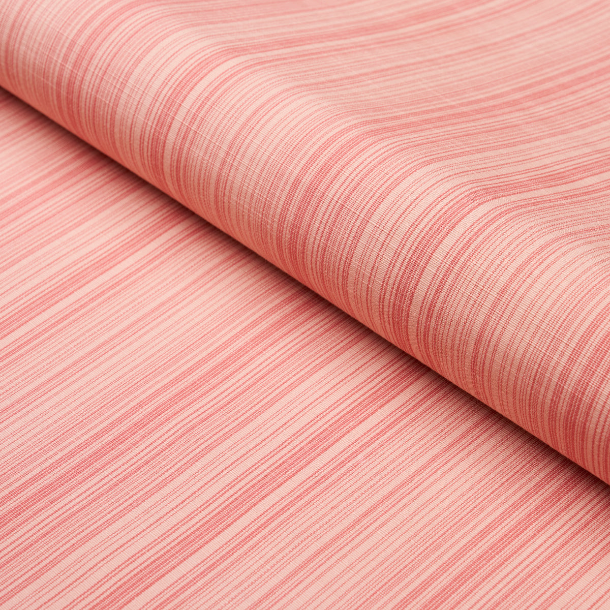 Coral-pink striped fabric roll with thin red lines, soft linen-like textile for clothing or home decor.