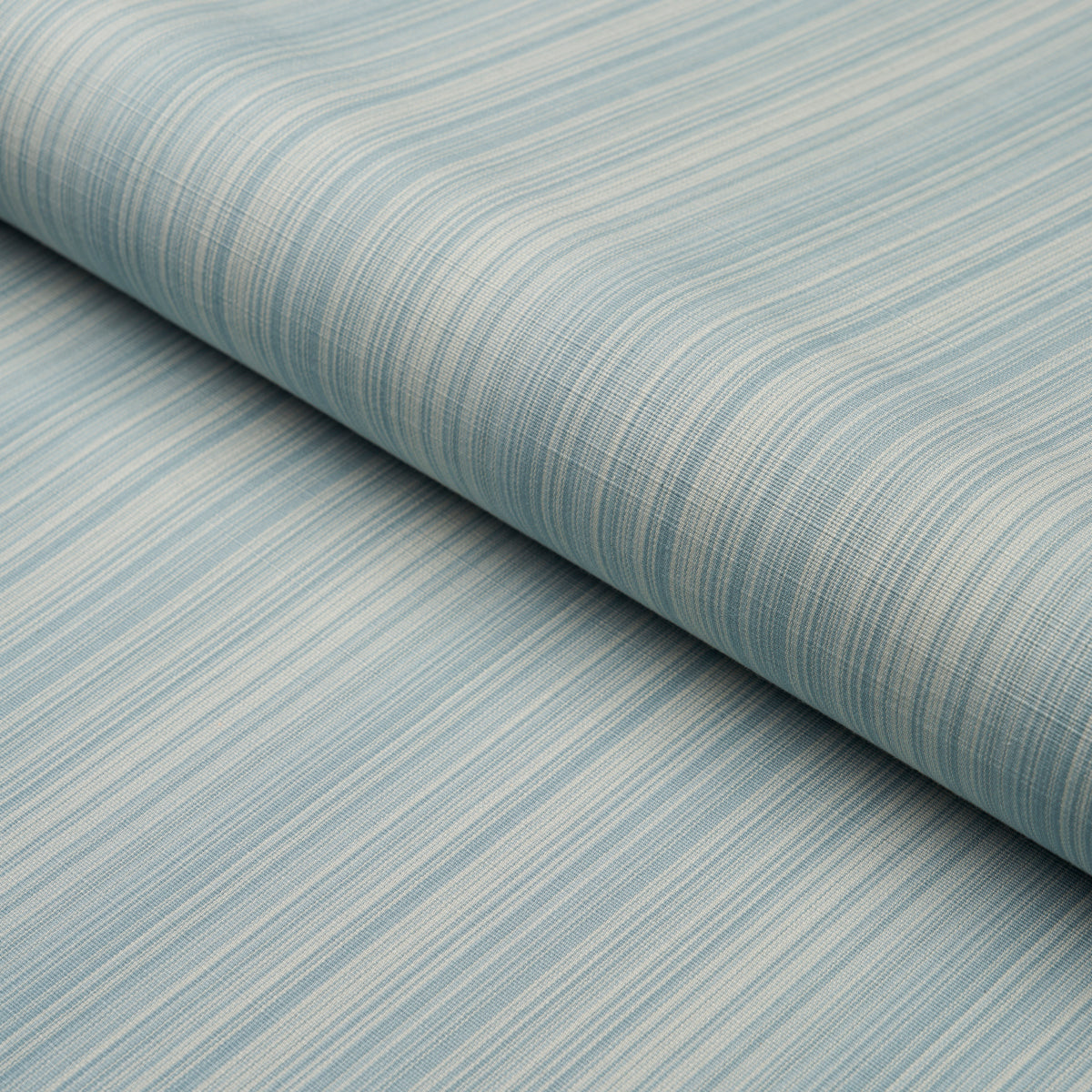 Light blue striped fabric roll with fine white lines; soft textured woven material, rolled edge visible.