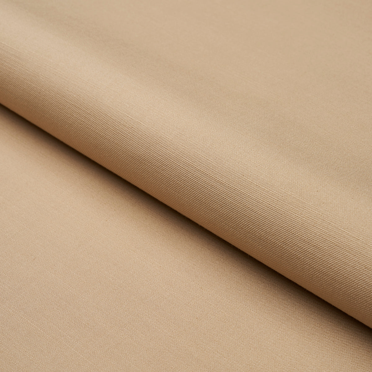 Beige fabric roll with a smooth weave and soft drape, folded diagonally.