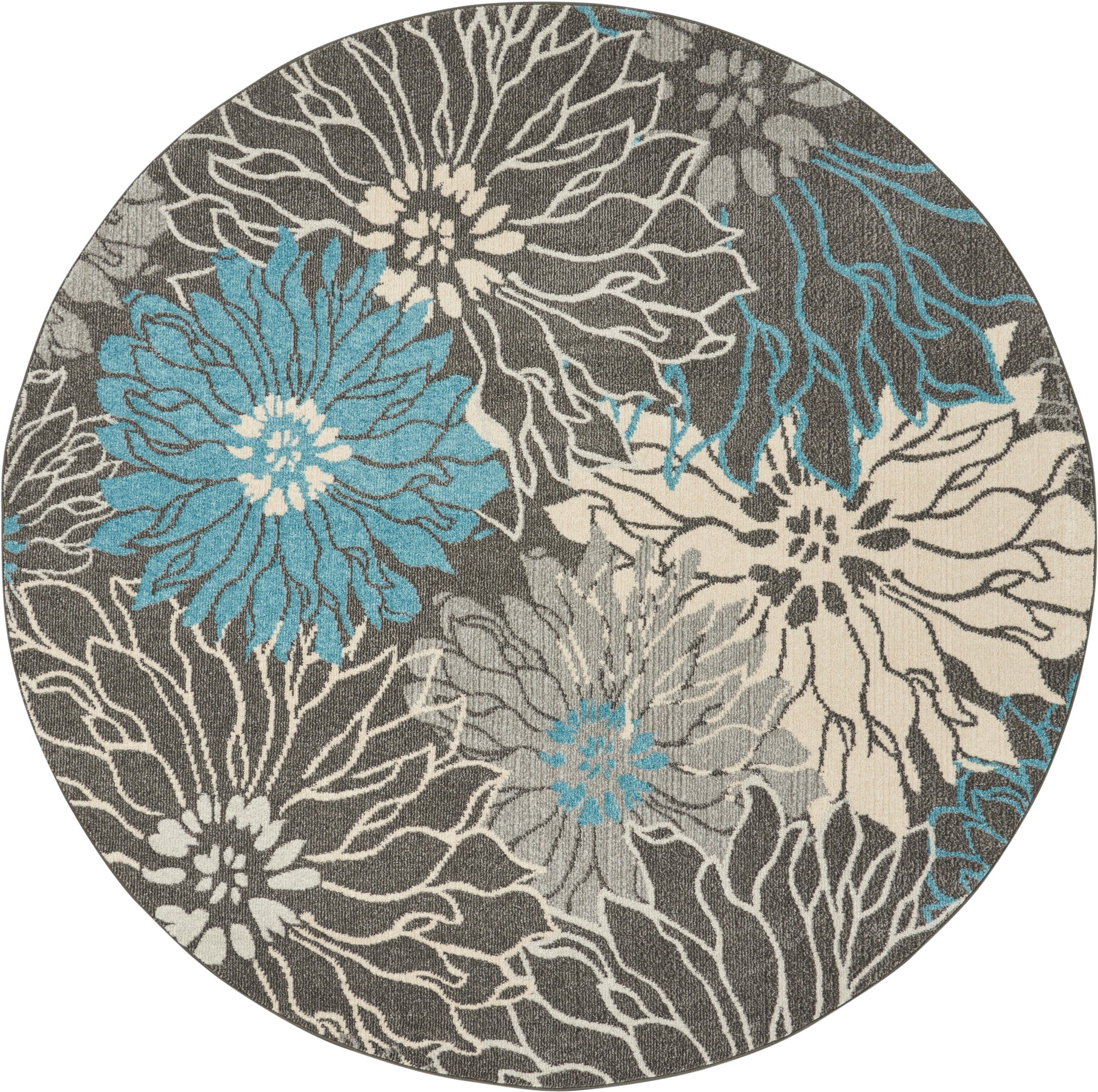 Round rug with teal blue and cream floral pattern on a gray backdrop; modern, textured botanical design.