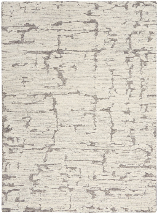 Cream and light gray abstract-pattern area rug; rectangular, modern style for living room or bedroom.