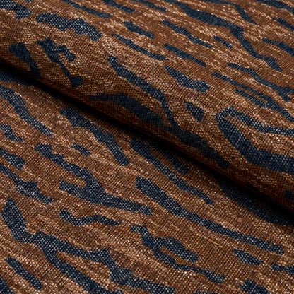 Brown and blue tiger-striped woven fabric with a textured upholstery weave.