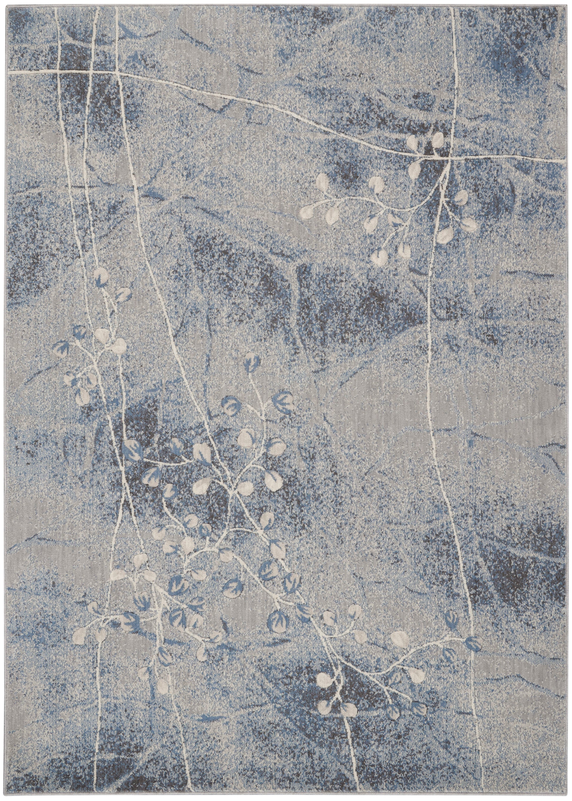 Rectangular blue-gray rug with speckled backdrop and white vine pattern; modern botanical look.