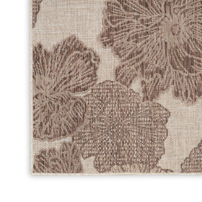 Beige woven rug with large brown floral damask pattern; tapestry-style, rectangular floor decor.