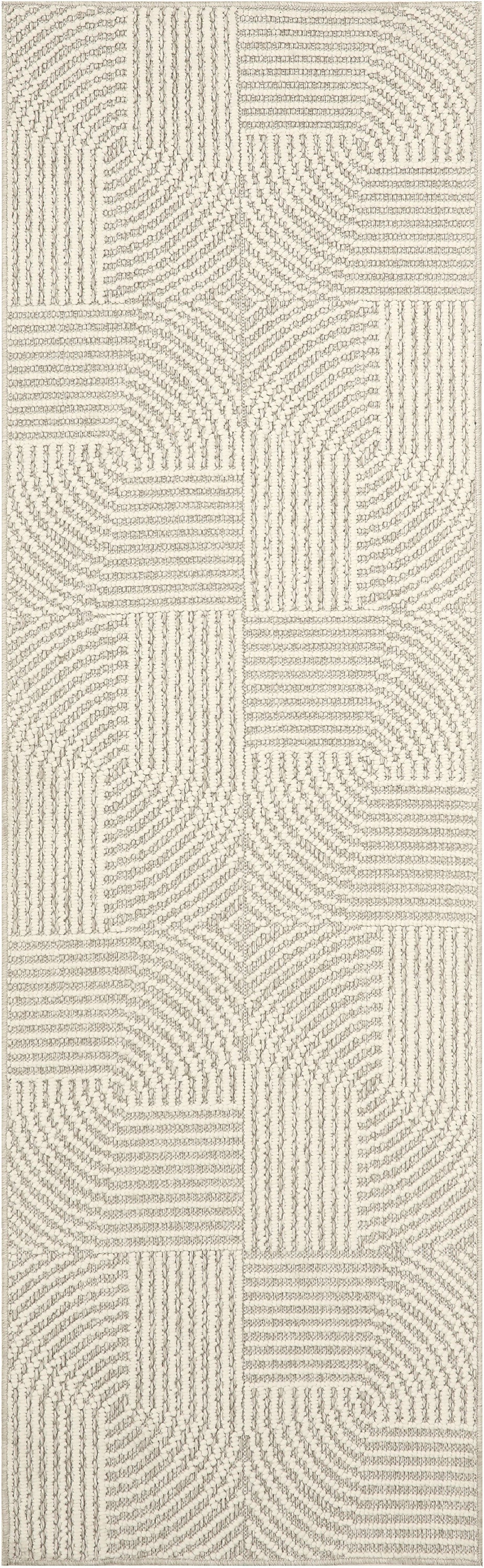 Beige rectangular rug with boucle texture and geometric patchwork of straight and curved lines.