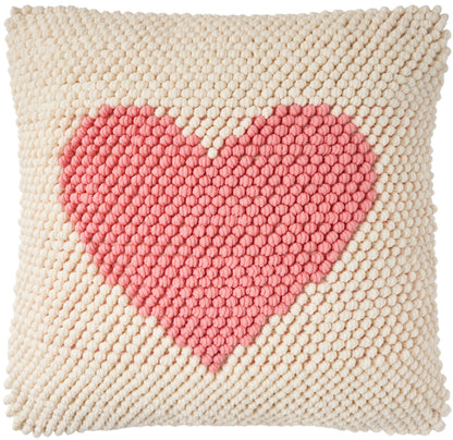 Beige chunky-knit square cushion with a pink heart motif; cozy boho home decor pillow.