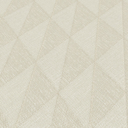 Cream textured fabric with geometric triangular facets; quilted look for upholstery or cushions.