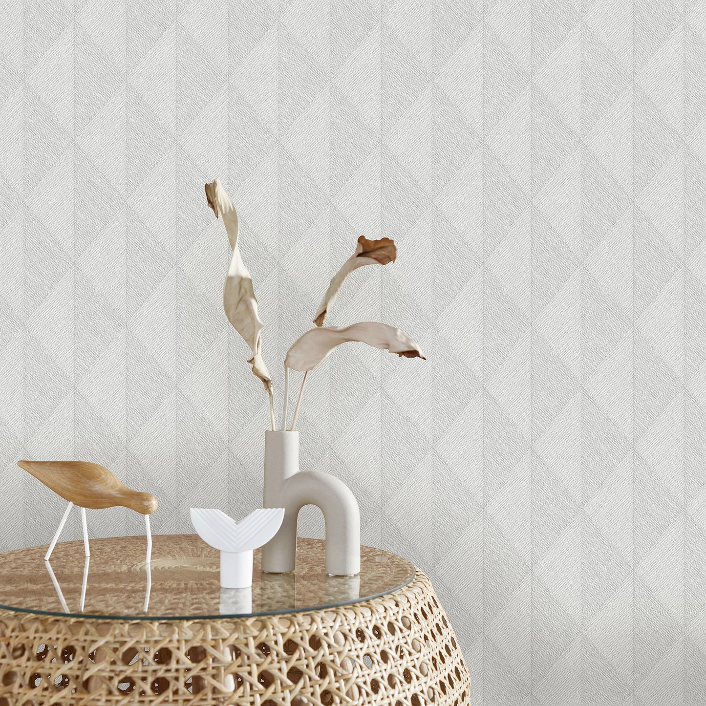 Gray wallpaper with a woven diamond pattern.