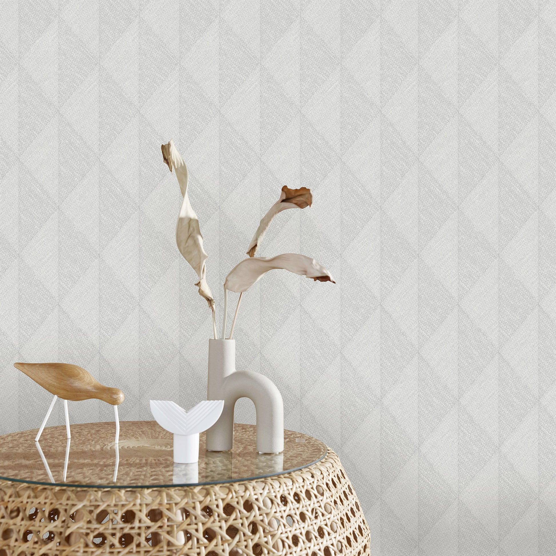 Gray wallpaper with a woven diamond pattern.