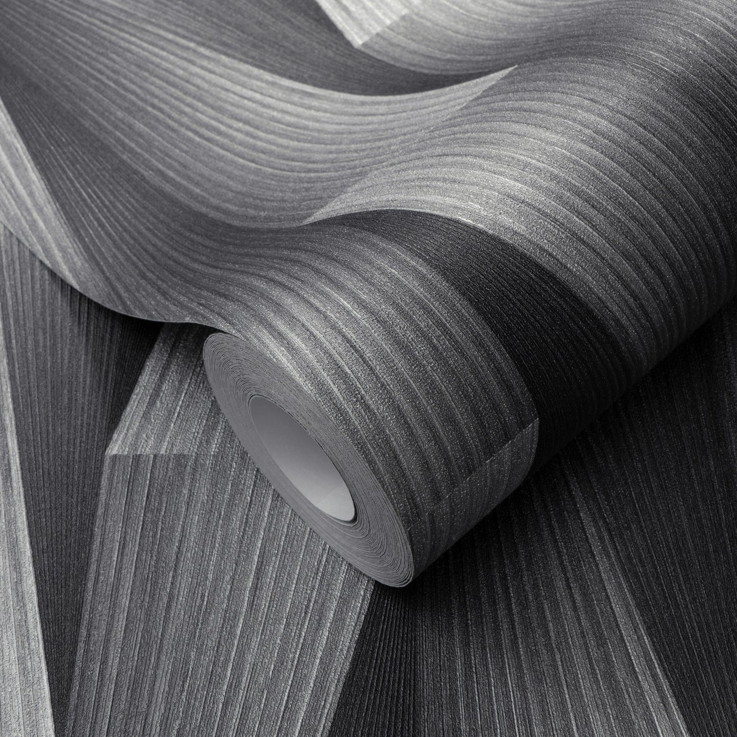 Rolled gray textured wallpaper with subtle linear wood grain pattern.