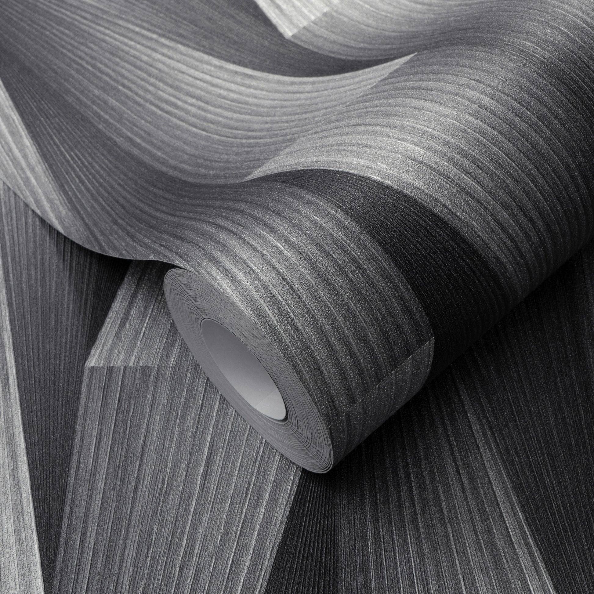 Rolled gray textured wallpaper with subtle linear wood grain pattern.