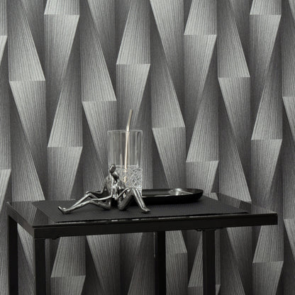 Close-up of silver wallpaper with a subtle metallic geometric pattern.