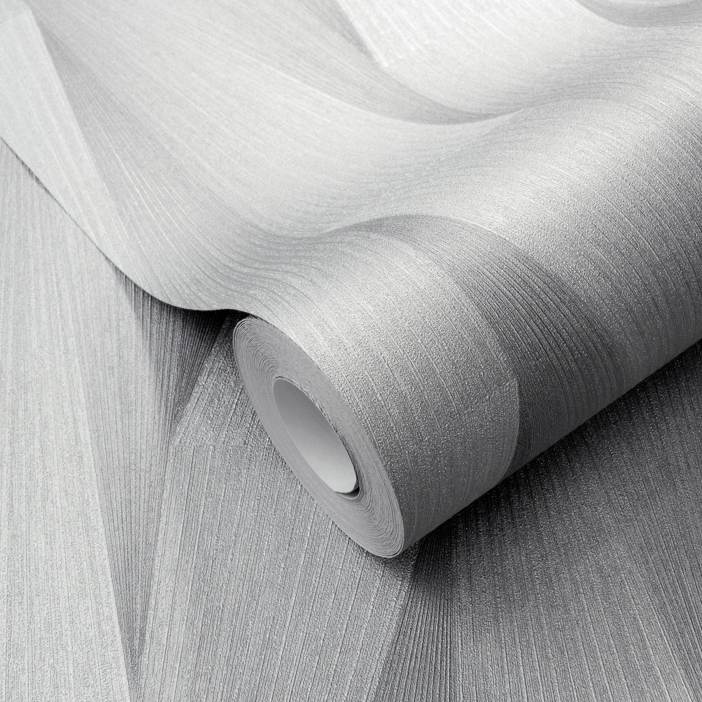 Light gray textured wallpaper roll with fine linear ribbing and matte finish, partially unrolled.