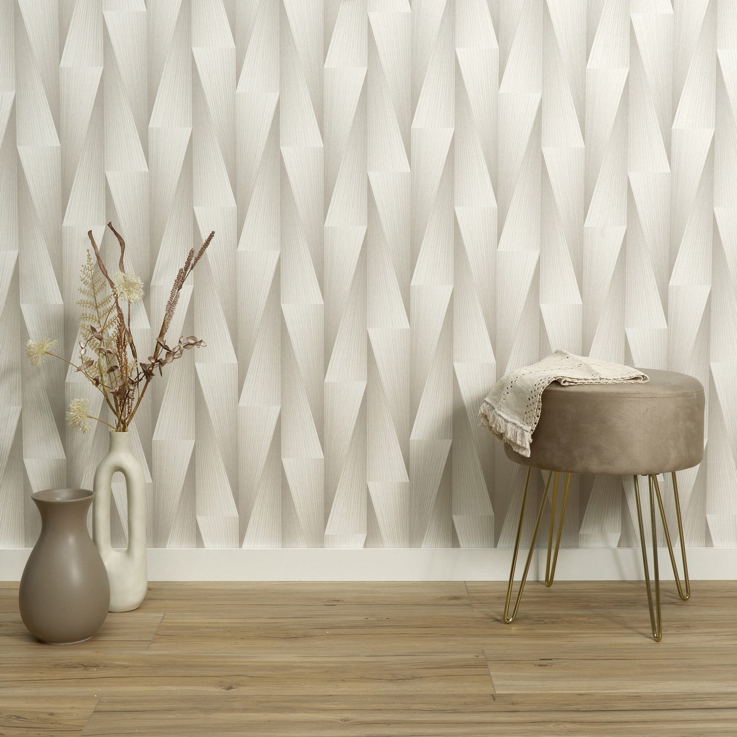 Taupe wallpaper with a subtle 3D geometric pattern.
