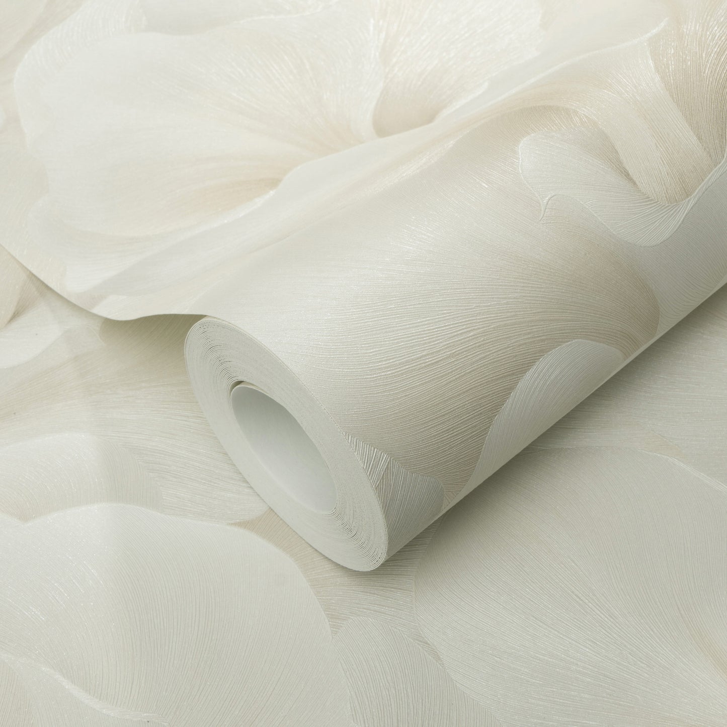 Beige wallpaper roll with a soft petal-like embossed pattern; rolled up.