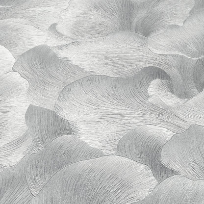 Silver wallpaper with a delicate floral motif on a gray background.