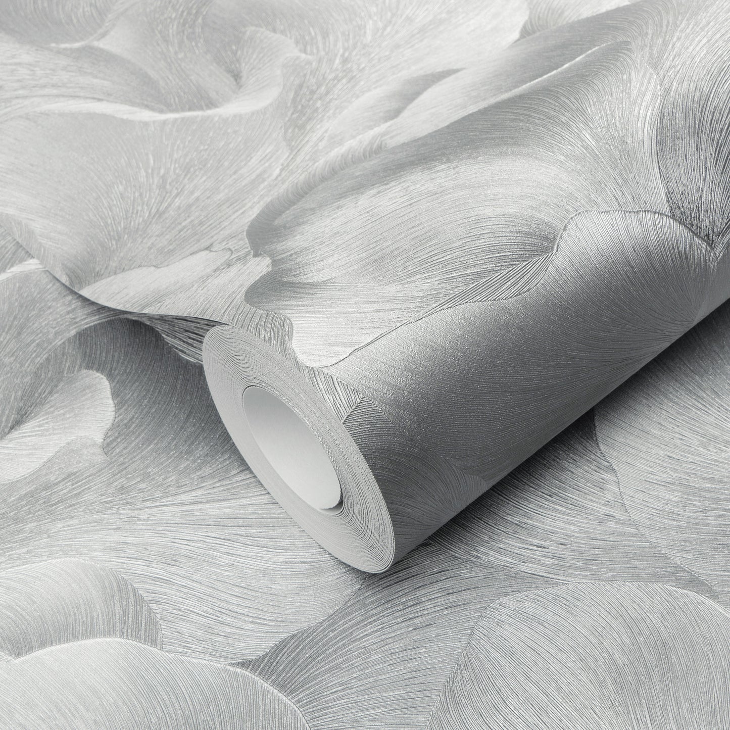 Wallpaper roll in silver-gray with abstract leaf pattern and subtle textured finish.