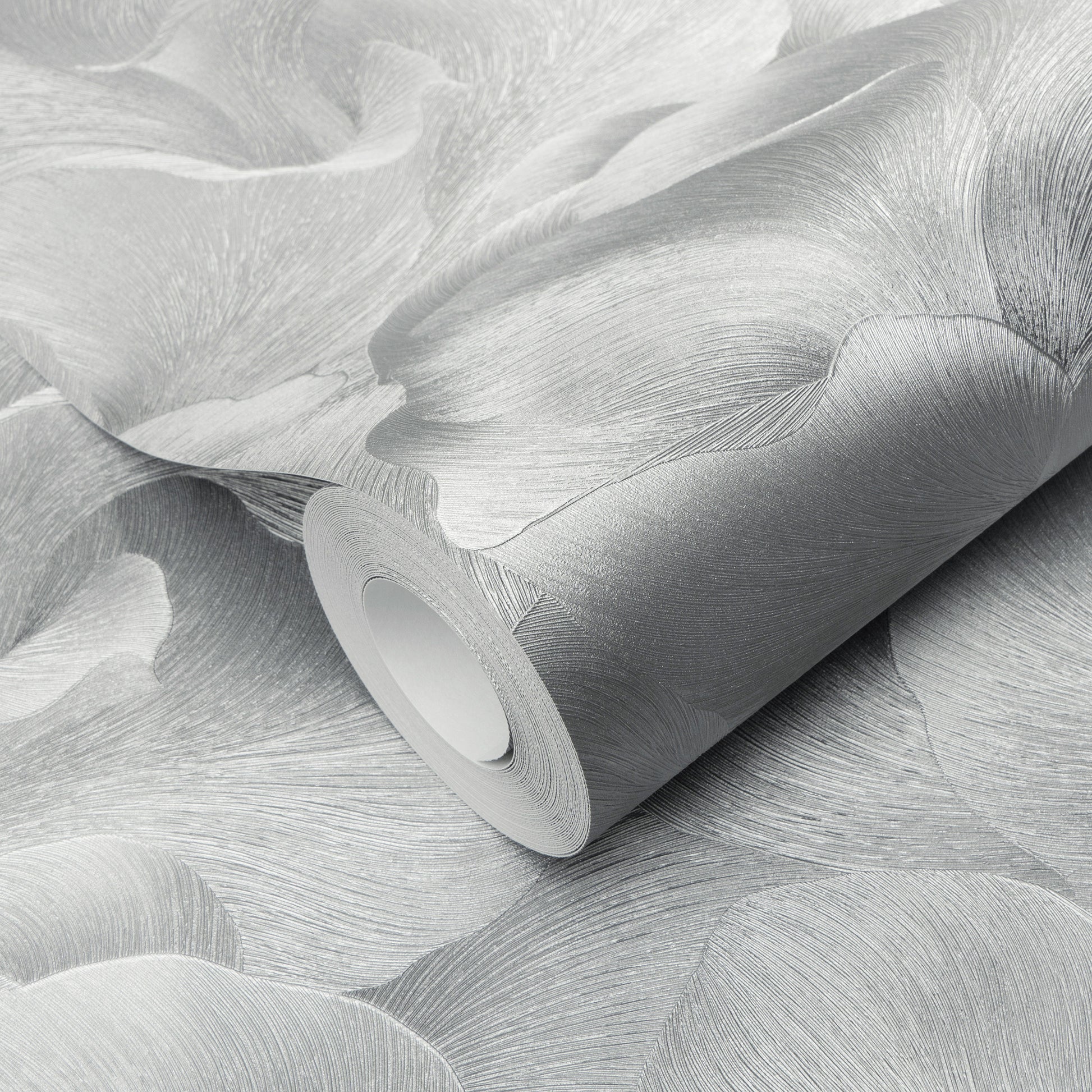 Wallpaper roll in silver-gray with abstract leaf pattern and subtle textured finish.