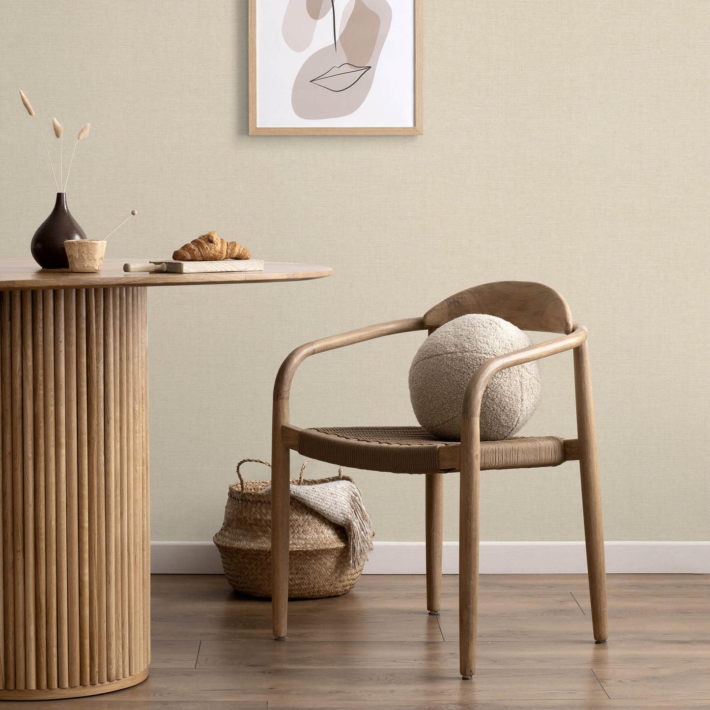 Beige wallpaper with a subtle jute texture and an abstract traditional pattern.