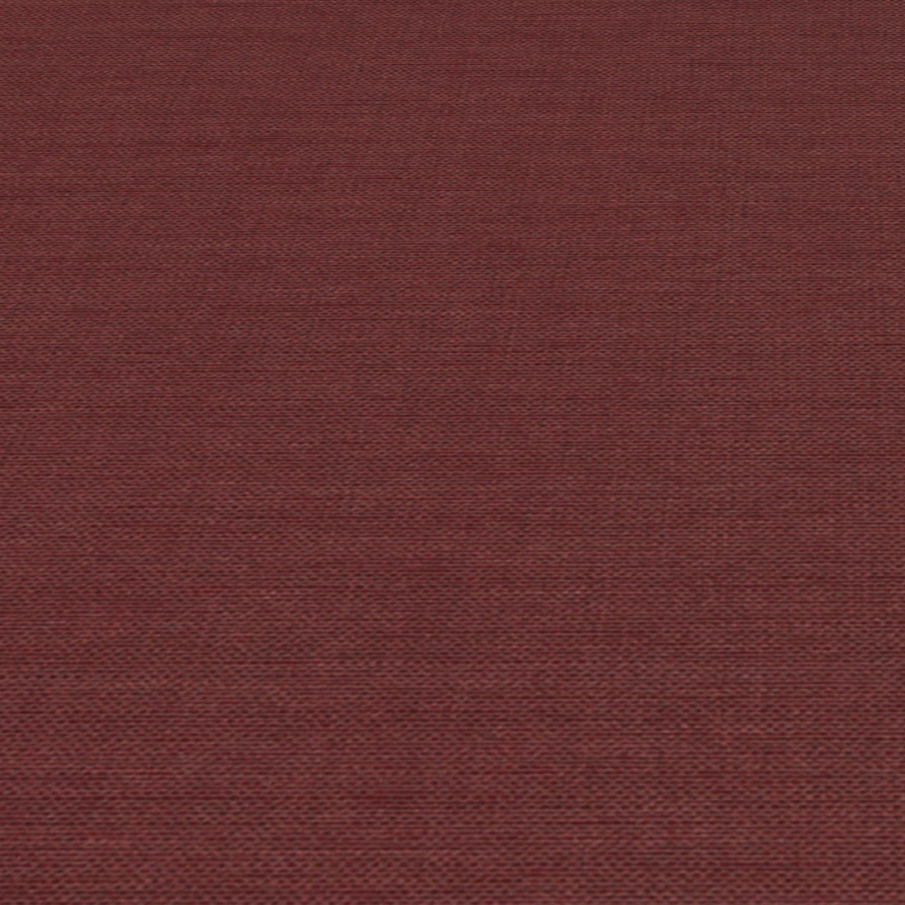 Rust-red jute-textured wallpaper close-up with visible fibers and subtle woven pattern.